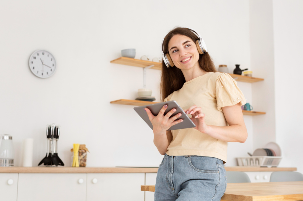 best wishlist for christmas Woman smiling while showing off new Amazon Echo device on her kitchen counter